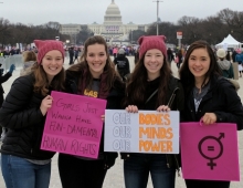 Picture of young women standing with signs in Washington D.C.